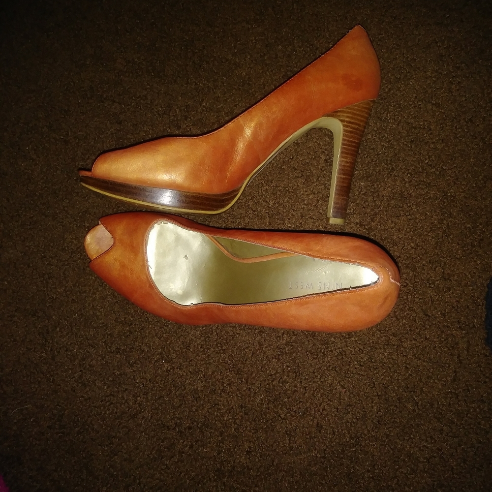 Worn burnt orange heels. Good shape on heel.